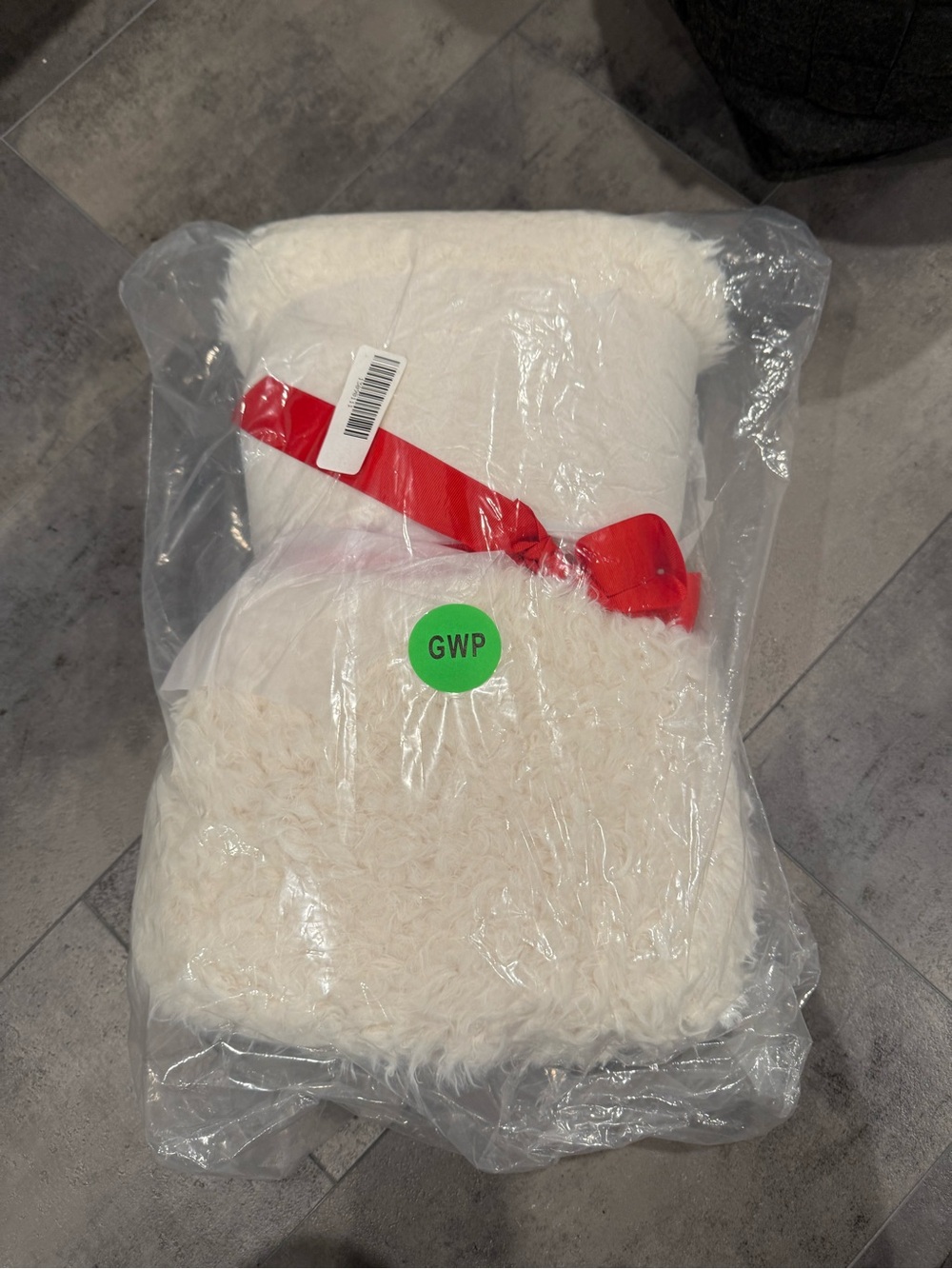 Express Ivory Faux Fur Throw with Red Ribbon Accent